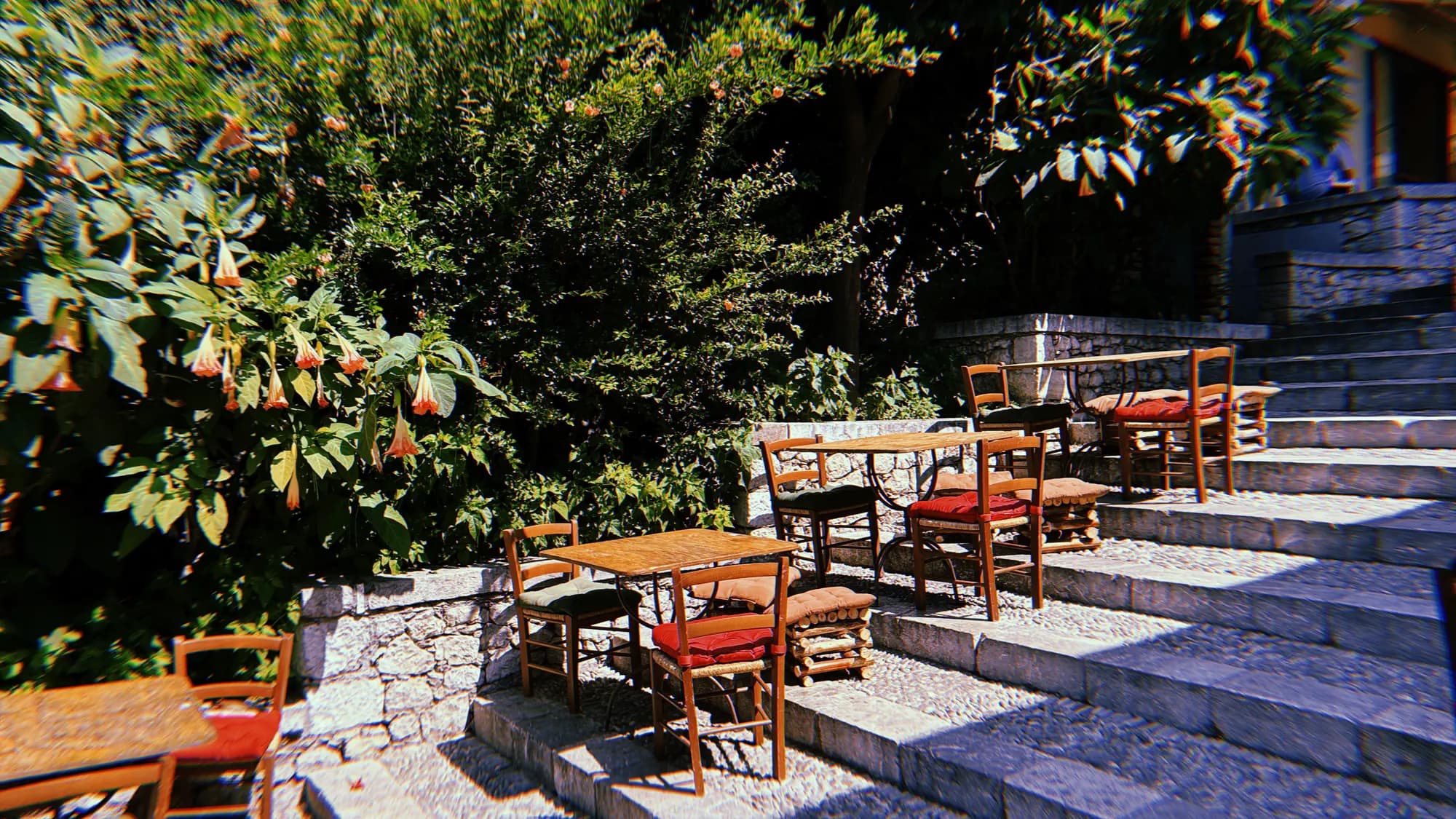 Café tables and chairs set out on a wide stone staircase